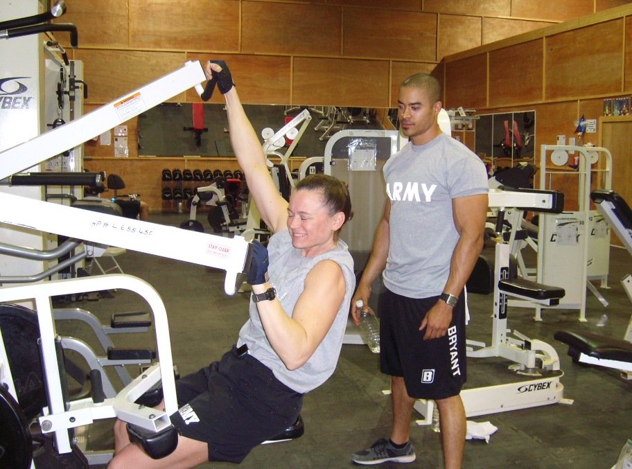 Coaching a soldier in an Army gym