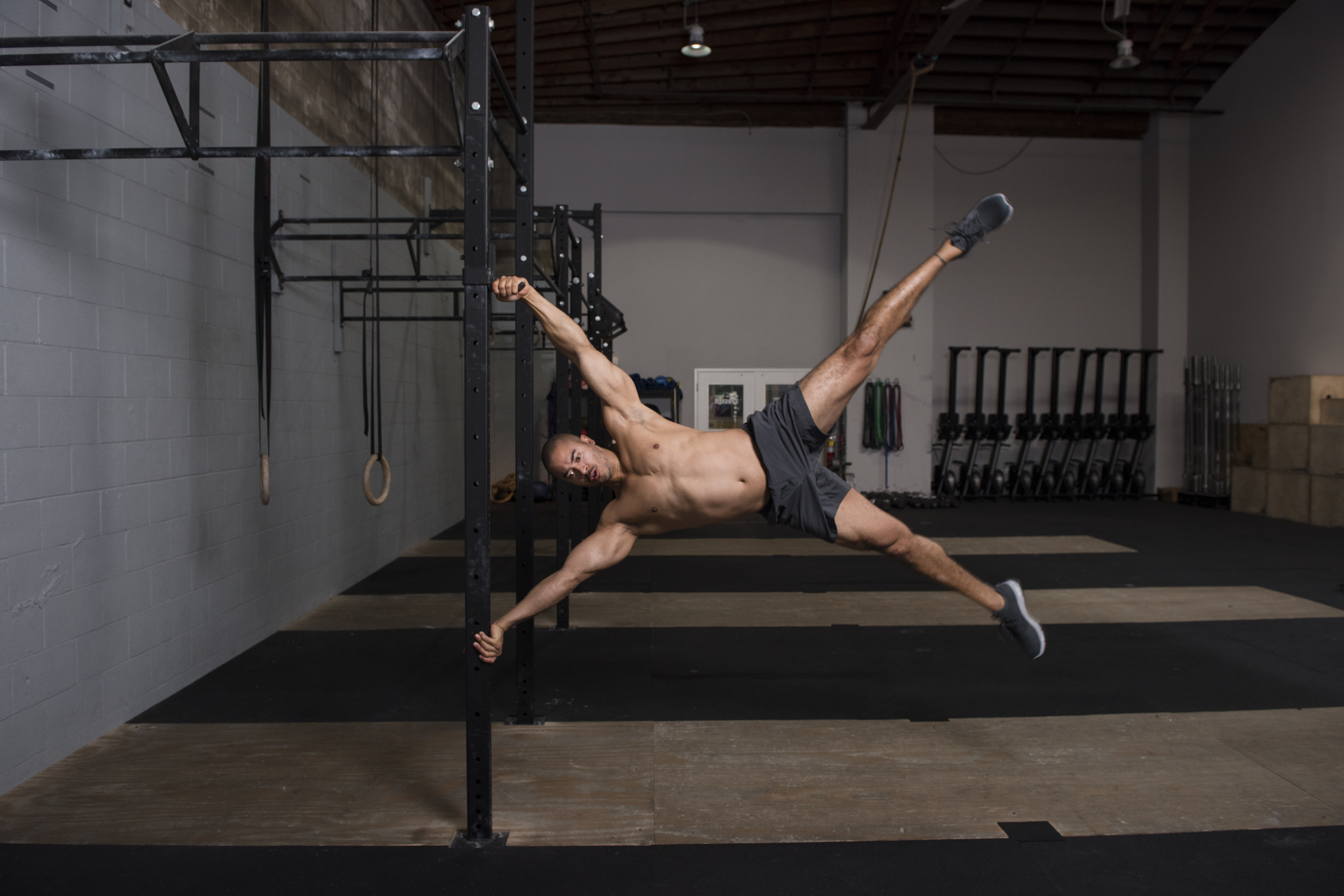 Human flag on a gym rig